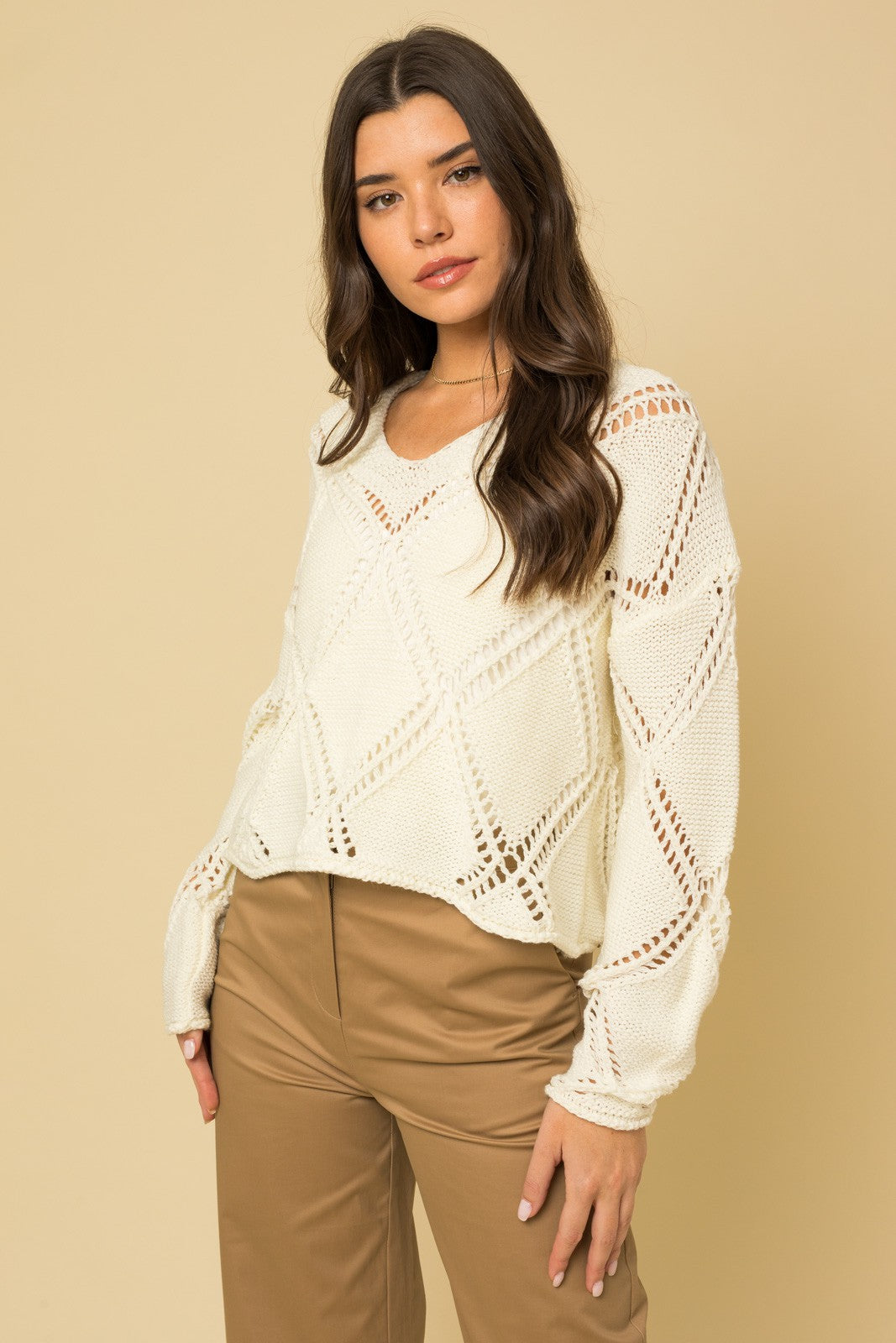 Introducing the Lonnie Sweater Top – where lightweight comfort meets a captivating argyle open knit design. Elevate your wardrobe with this must-have statement piece that effortlessly exudes cool vibes. Its versatile charm ensures you'll find yourself reaching for it time and time again, whether you're aiming for casual chic or a laid-back elegance. Don't miss out on the chance to make the Lonnie Sweater Top a timeless addition to your collection, setting the standard for effortless style.