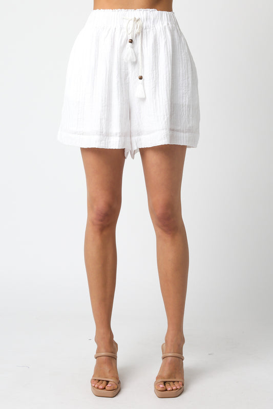 A white lightweight woven short with a drawstring waist