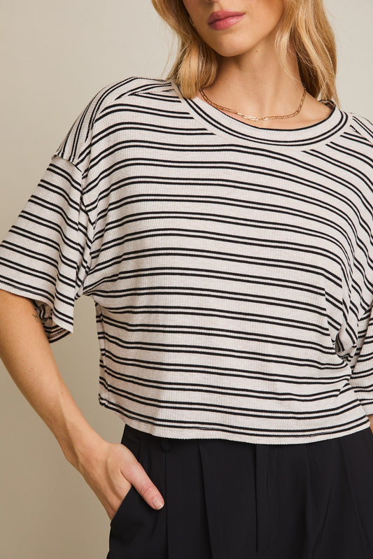 An oatmeal and black striped short sleeve tee